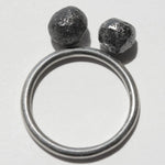 4.13 carat black round raw diamond pair