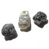 24.36 carat white, black and gray raw diamond parcel