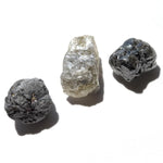 24.36 carat white, black and gray raw diamond parcel