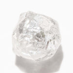 1.15 carat round and white raw diamond dodecahedron