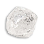 1.15 carat round and white raw diamond dodecahedron