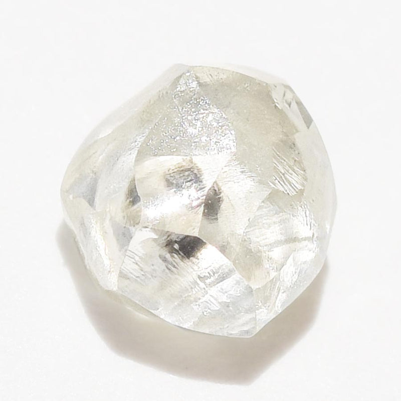 0.57 carat light and clear raw diamond rhombododecahedron