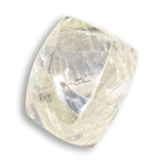 0.74 carat waterlike and yellow greenish rough diamond dodecahedron