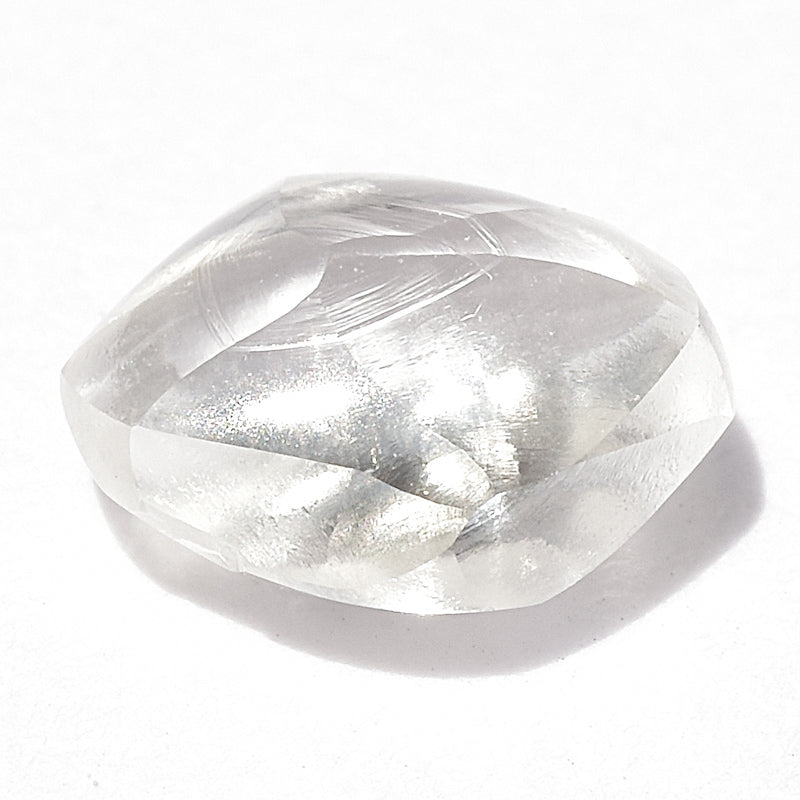 0.71 carat white with light green undertone rough diamond dodecahedron