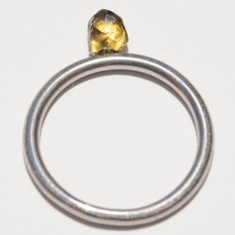 0.67 carat glowy and olive colored freeform rough diamond