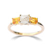 The Keren ring model - a rough diamond engagement ring with two bright apricot sapphires