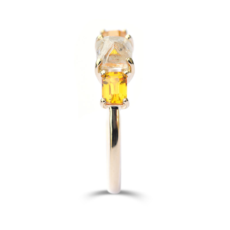 The Keren ring model - a rough diamond engagement ring with two bright apricot sapphires