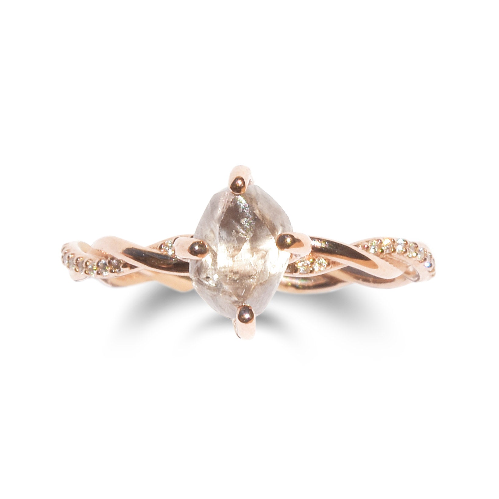 The Gefen ring - a raw diamond engagement ring with a twisted gold band with inlaid cut diamonds.