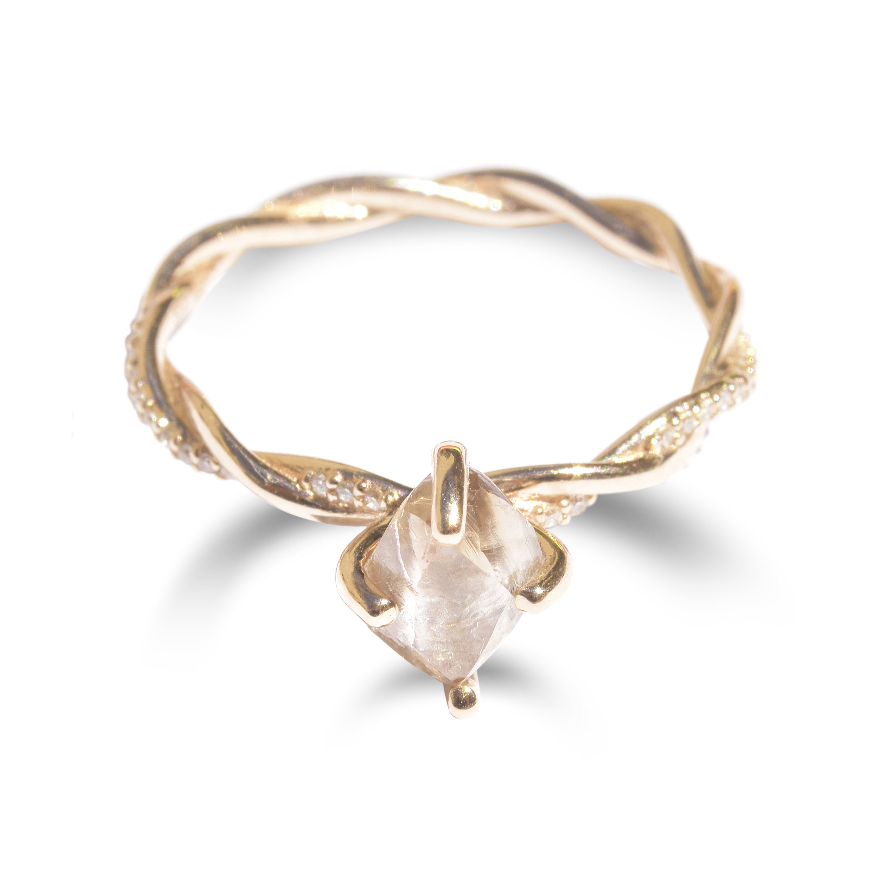 The Gefen ring - a twisted raw diamond engagement ring completely handmade with inlaid melee on the band.