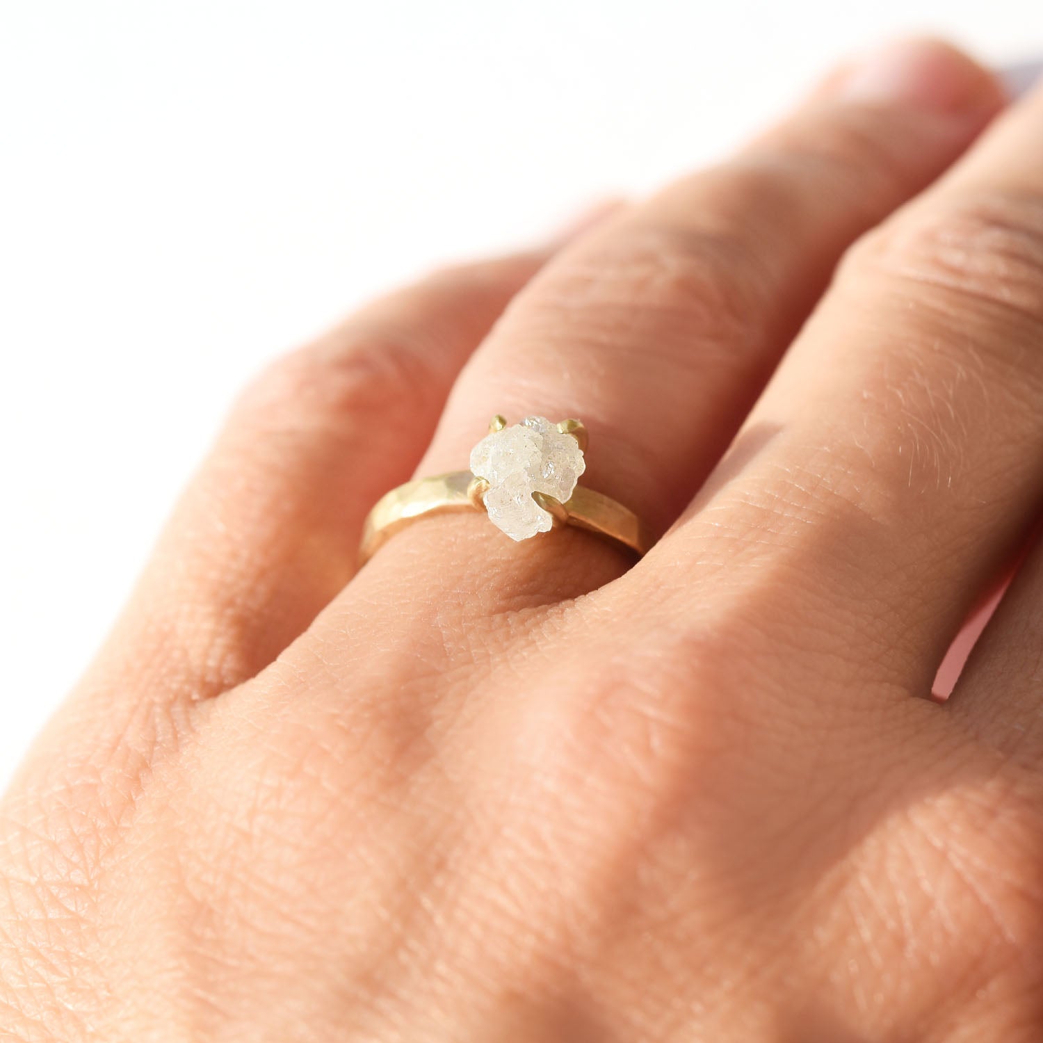 The Midbar Ring - a hammered rough diamond engagement ring with four prongs