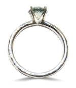 Hammered 14k white gold ring with a 7mm mermaid lime sapphire held by four prongs