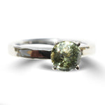 Hammered 14k white gold ring with a 7mm mermaid lime sapphire held by four prongs