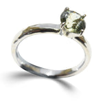 Hammered 14k white gold ring with a 7mm mermaid lime sapphire held by four prongs