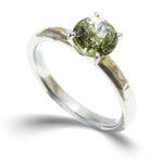 Hammered 14k white gold ring with a 7mm mermaid lime sapphire held by four prongs