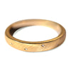 Brushed natural gold wedding band with embedded diamonds