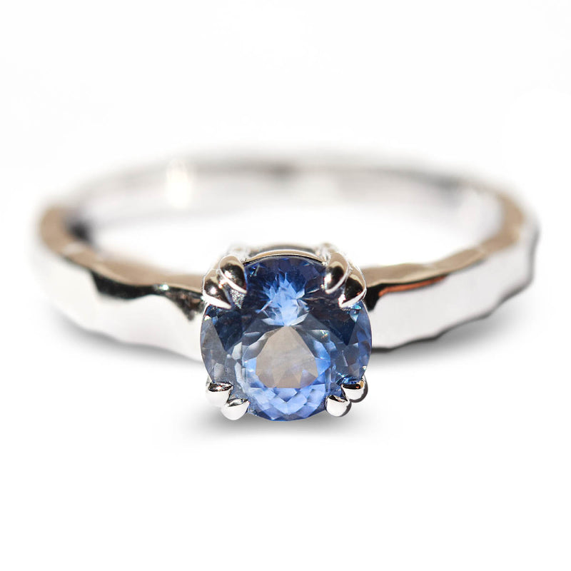 Ice blue sapphire solitaire engagement ring with double prongs and hammered band
