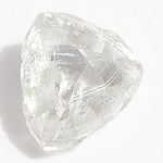 0.53 carat glowy light green raw diamond triangular macle