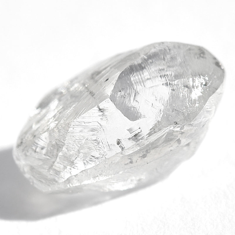 0.94 carat excellent white and slight green rough diamond dodecahedron