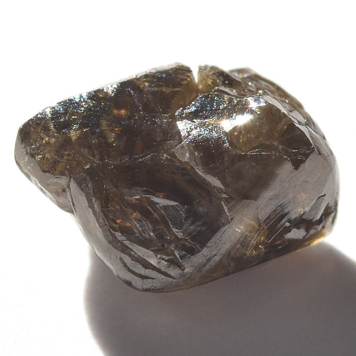 1.69 carat deep brown freeform rough diamond