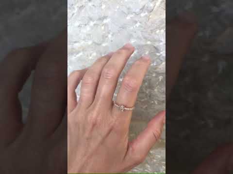 Video of the Kerah ring - a rough diamond ring with U shaped prongs and melee on the band
