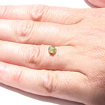 0.78 carat shimmery olive green rough diamond rhombododecahedron