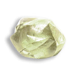 0.78 carat shimmery olive green rough diamond rhombododecahedron